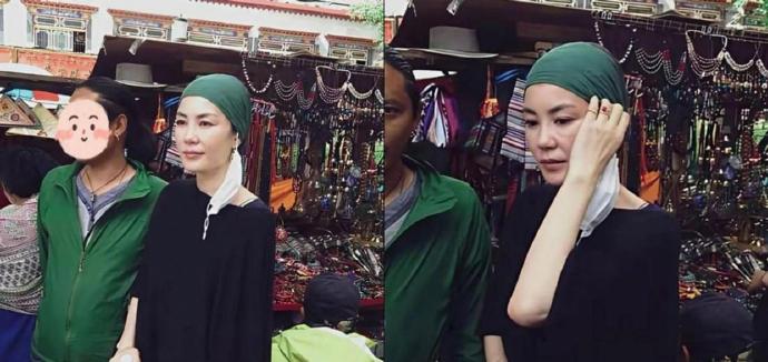 王菲在拉萨小庙被拍，她穿着宽大的藏袍，头巾随便包着。​​​