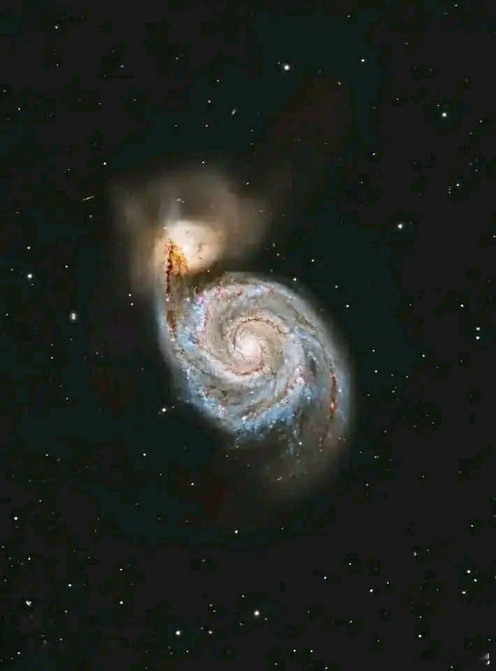 一场真正具有宇宙规模的旋风！瞧瞧漩涡星系——M51——整个夜空中最令人叹为观止的