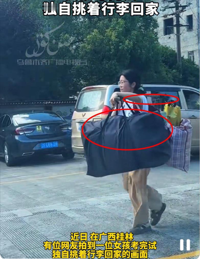 一觉醒来，桂林那个挑着行李的高三女孩可真火了！乍一看，她用木棍挑着行李，确
