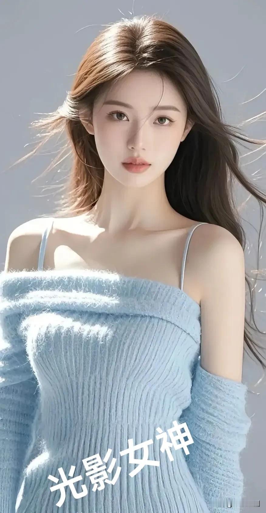 女人味的魅力在哪里?浅蓝毛衣在光影里漾着温柔，发丝随风轻舞，她是捕捉了光的女神