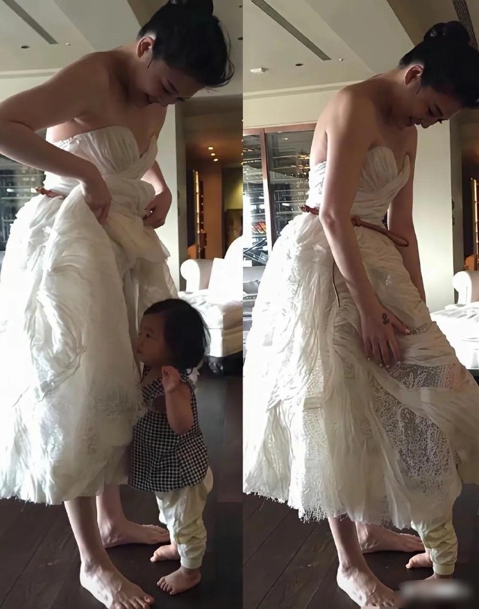 大S徐熙媛生完小玥儿复出的时候，穿着礼服，小玥儿跑来抱她，钻到妈妈漂亮裙子底下，