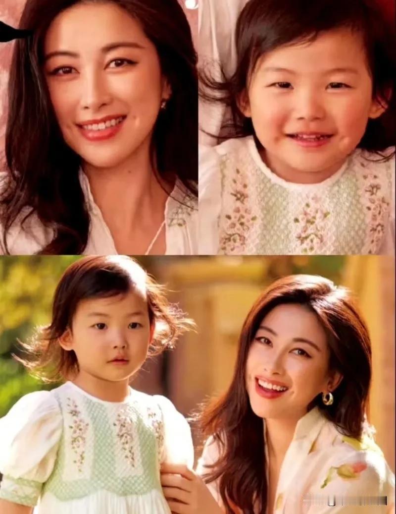 朱珠的女儿遗传了她迷人的小梨涡甚是可爱。很多网友说眼睛很像妈妈啊，妈妈本来就是单