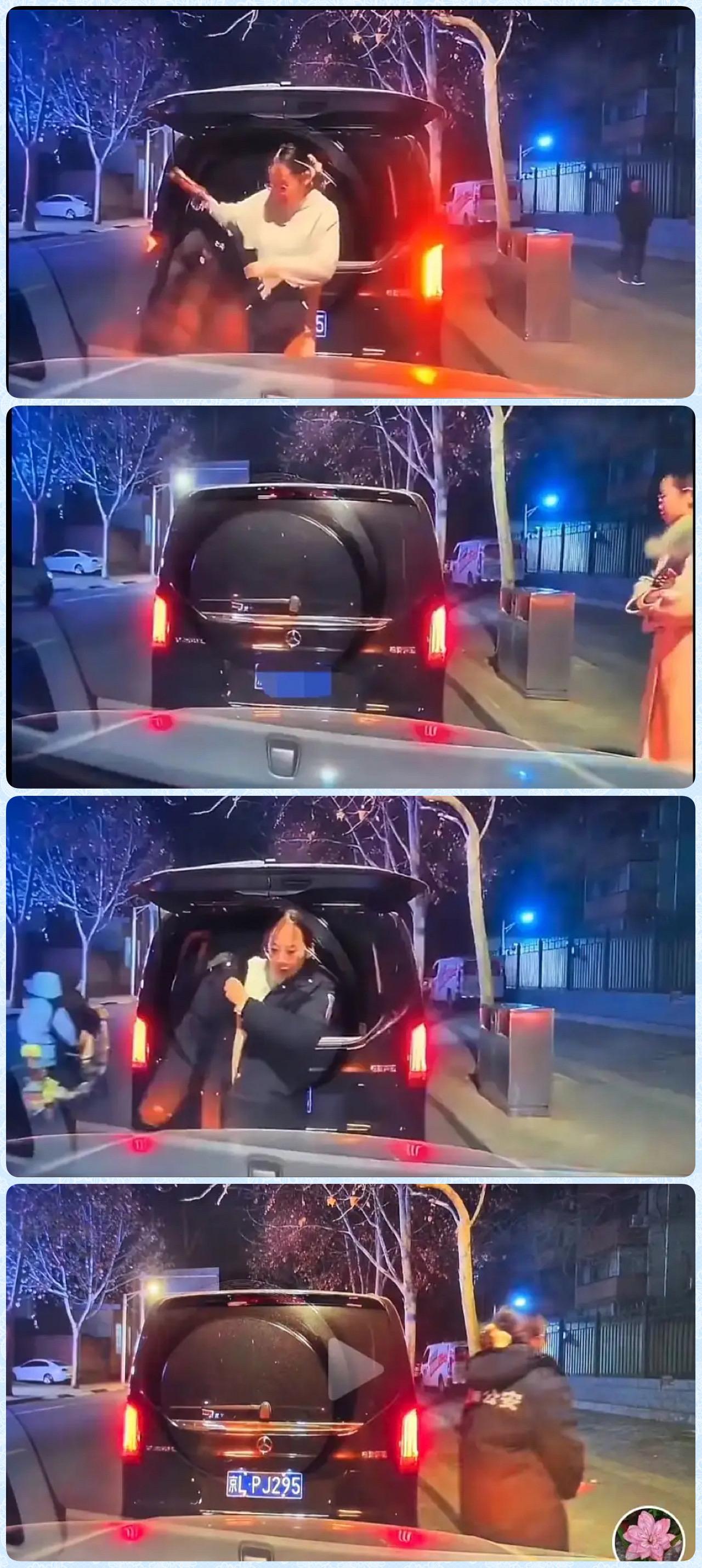 某街道，两个女车主因为冲突在路边等待交警的到来。北京奔驰女车主非常淡定从奔驰后备