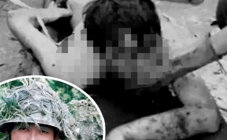 这是云南麻栗坡的洗尸台，工作人员正在给牺牲的解放军战士清洗遗体，记者拍下了这张悲