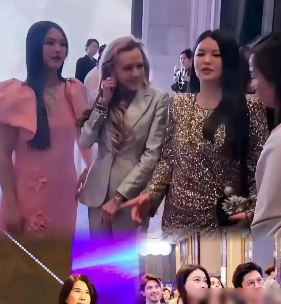 李湘拎着铂金包凑到董明珠跟前想合影，董明珠低头刷手机，连眼皮都没抬，只轻轻摇了下