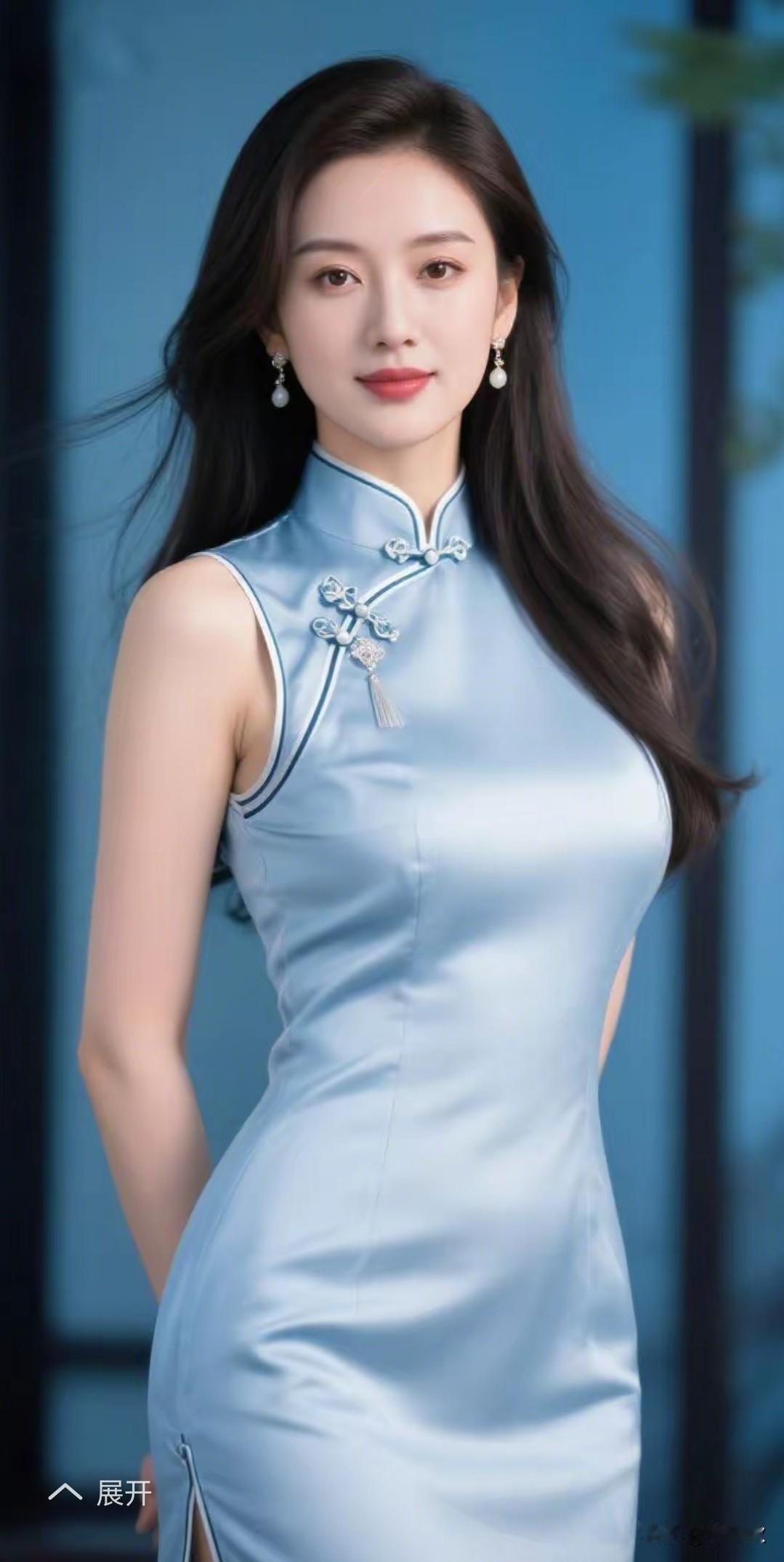 旗袍雅致衬娇容，一袭蓝色显风情。青丝如瀑随风舞容颜绝世韵倾城。