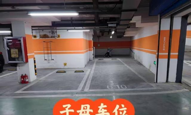湖南湘乡，钟某花531163元通过中介买了一套带子母车位的毛坯房，可在办理车位过