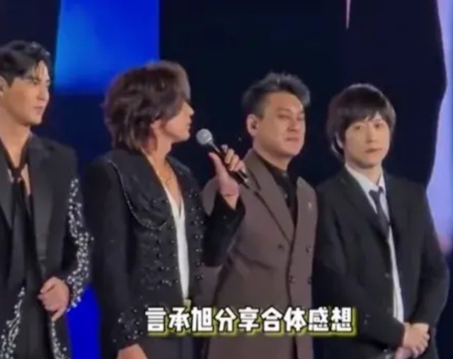 气质都不一样～长期在大陆生活的朱孝天同志，气宇轩昂，着装有别于F3，一副傲气自然