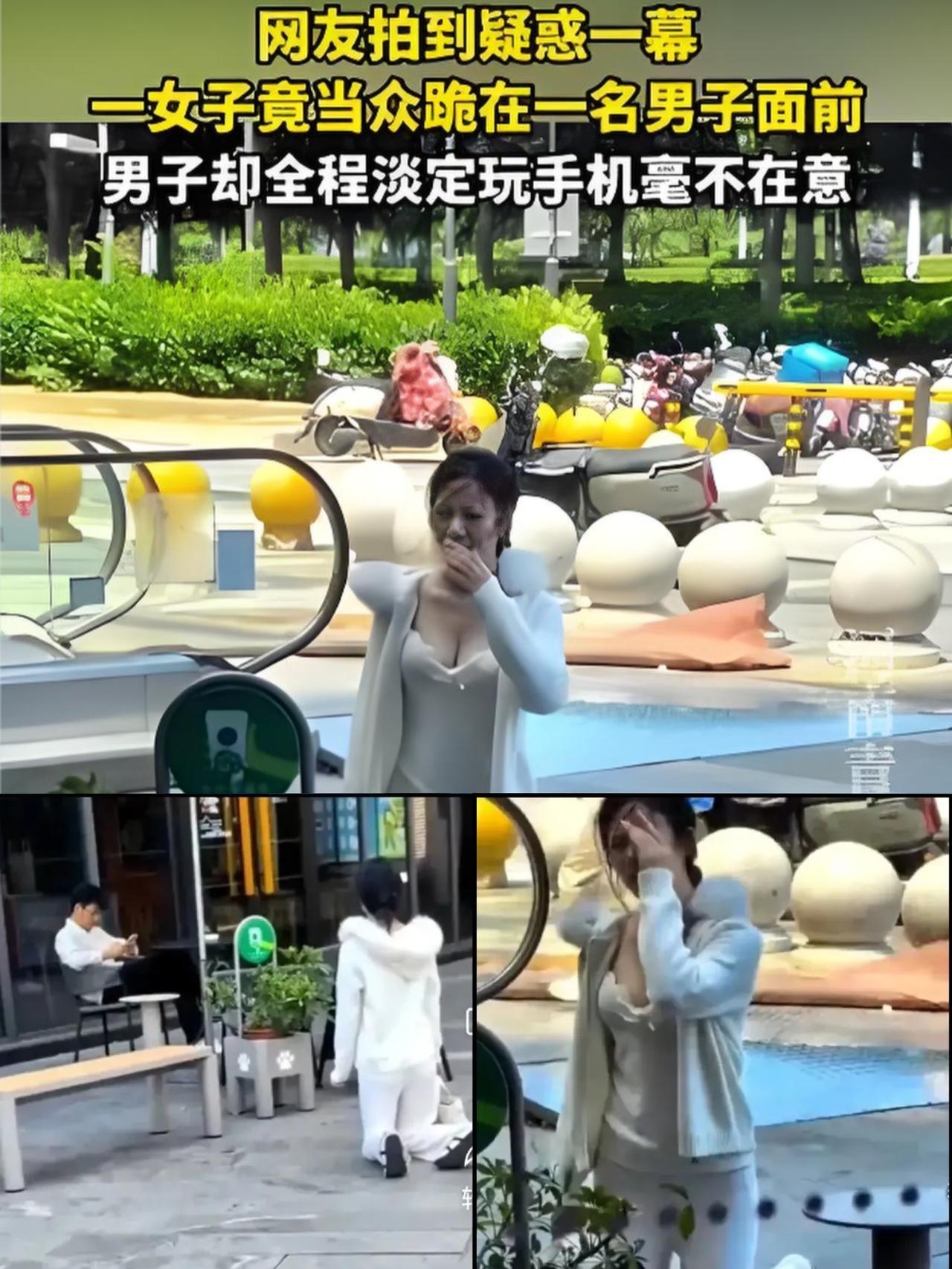 5月16日上海街头的一幕，看得人直摇头，一名衣着清凉的年轻女子当众跪在男子身前