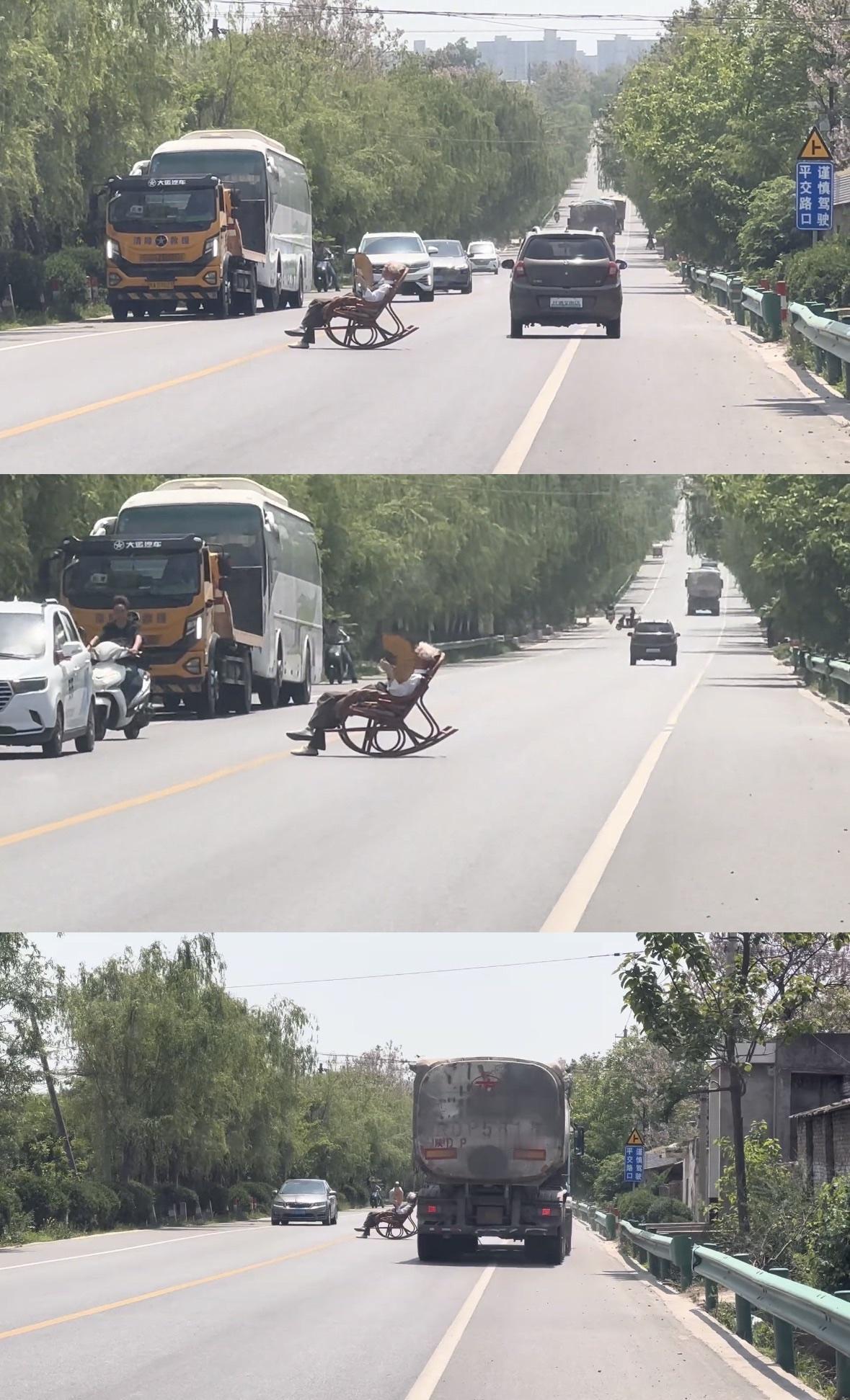 车主反映陕西一大爷马路中间晒太阳，来往车辆纷纷躲避。陕西一大爷将摇椅搬到马路