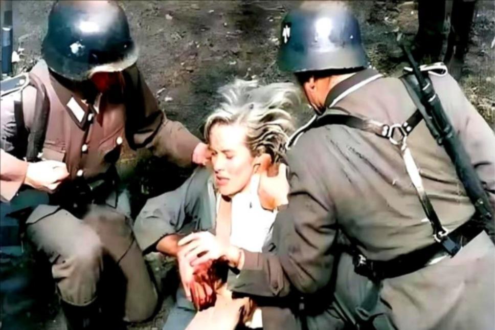 1944年6月，照片中这位被纳粹士兵粗暴制服的年轻女子，是年仅23岁的英国特工维