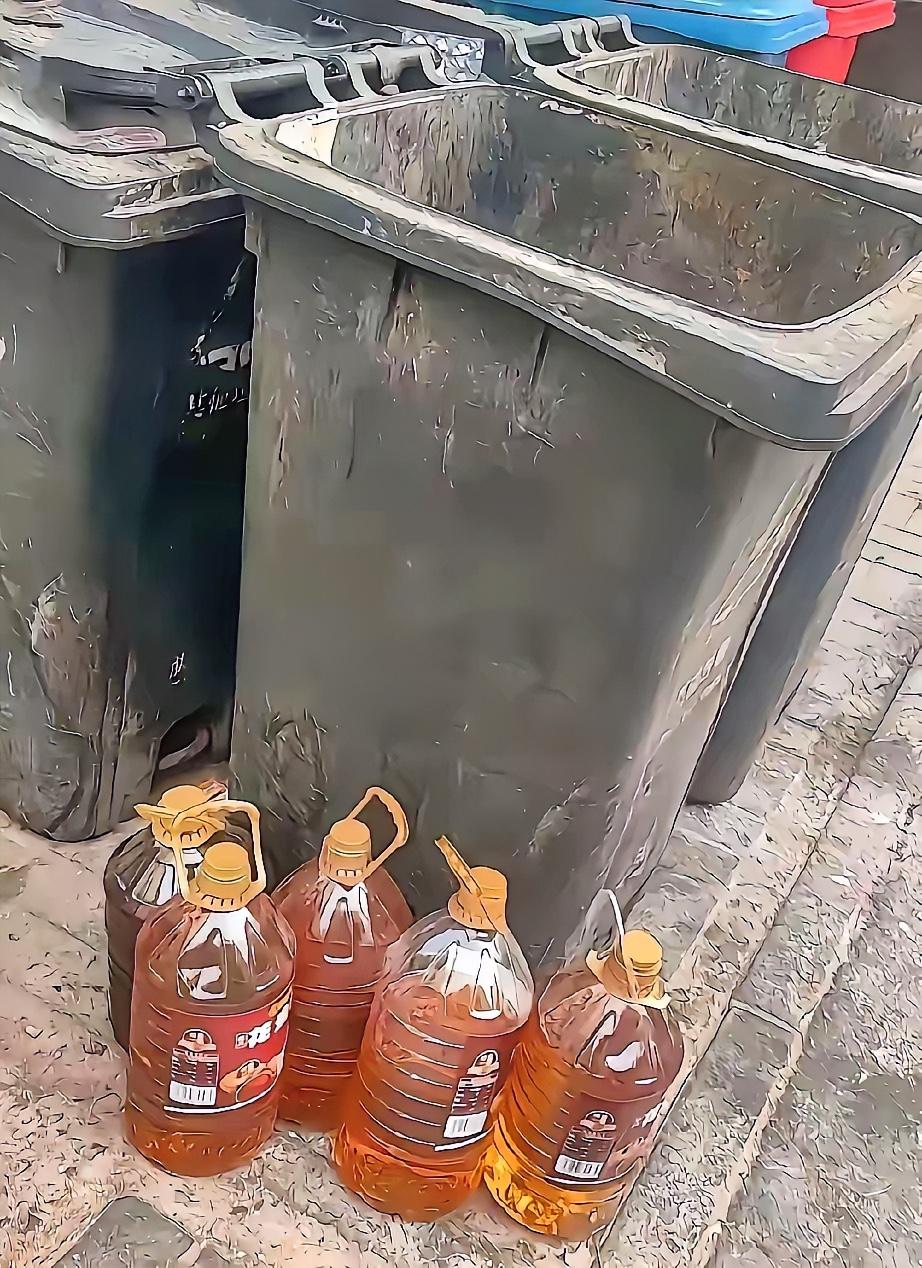 今早上下楼扔垃圾，老远就看见垃圾桶边上有几桶油，我就快走了几步，扔了垃圾，拿起了
