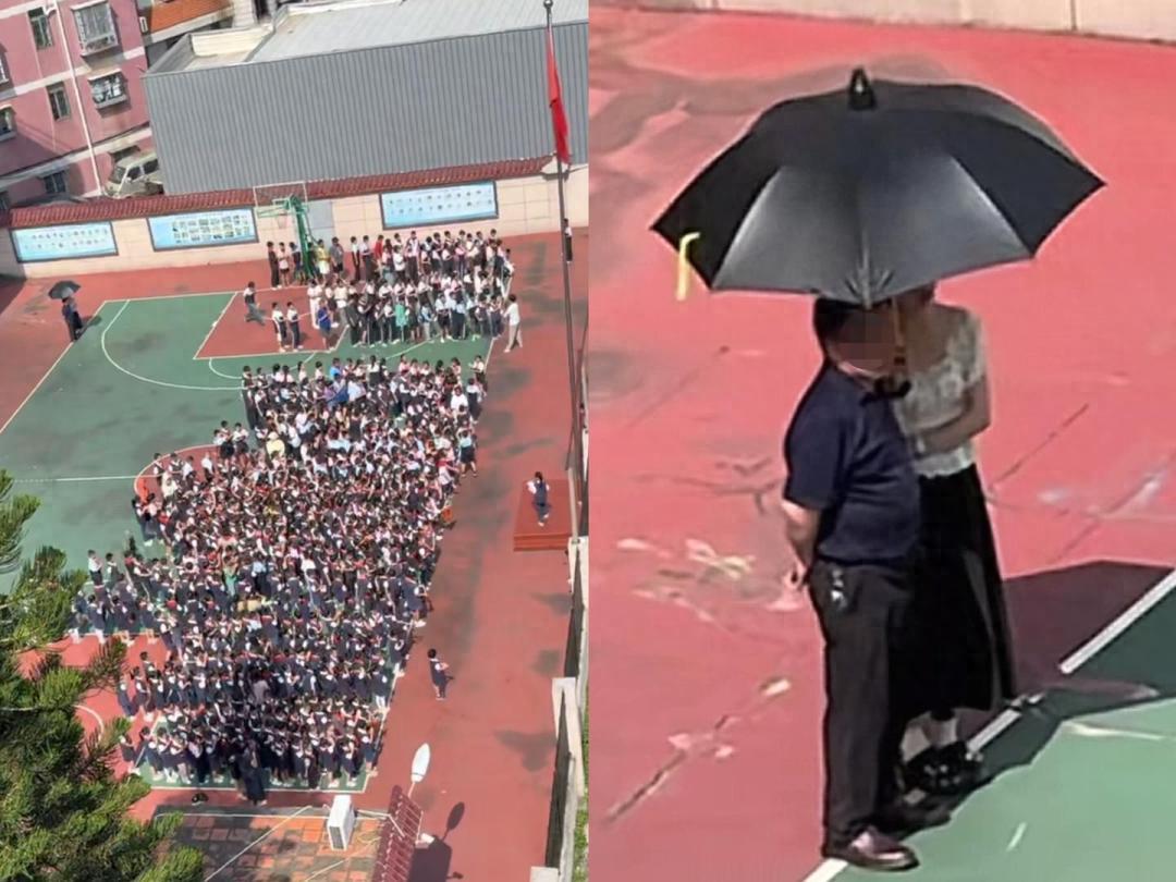 福建厦门某学校操场，一群学生顶着烈日参加活动，一名女教师却全程为身旁背手的男子撑