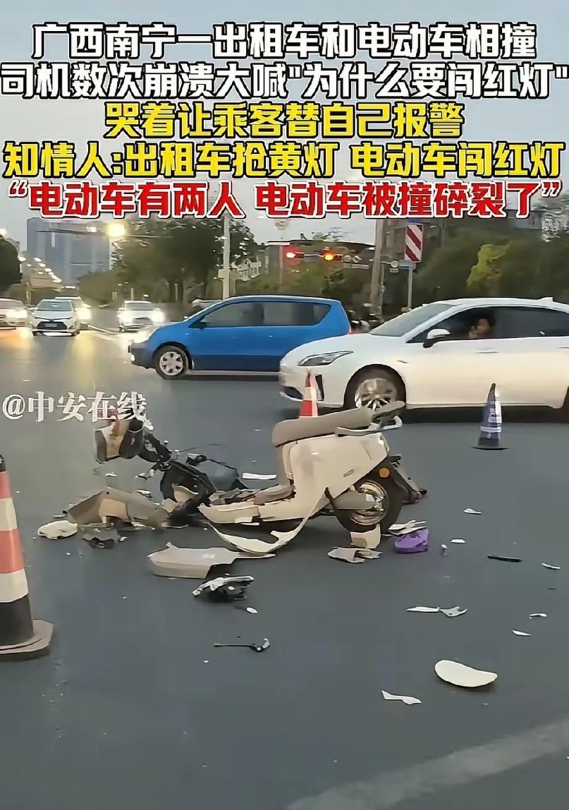 3月17日广西南宁！男子开着出租车经过十字路口时，发现前方红绿灯闪着黄灯就加速行