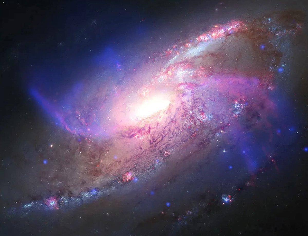你正在观察M106星系，这是一个位于约2400万光年之外的螺旋星系，它拒绝停留在