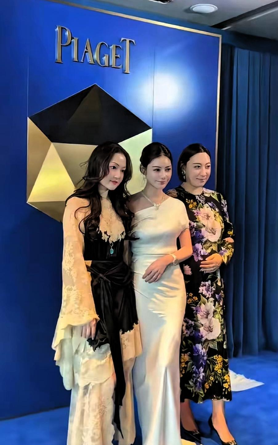 那个女的，穿白裙子，去参加宴会。看着很从容，大家觉得她不一样。她自己有钱，不用靠