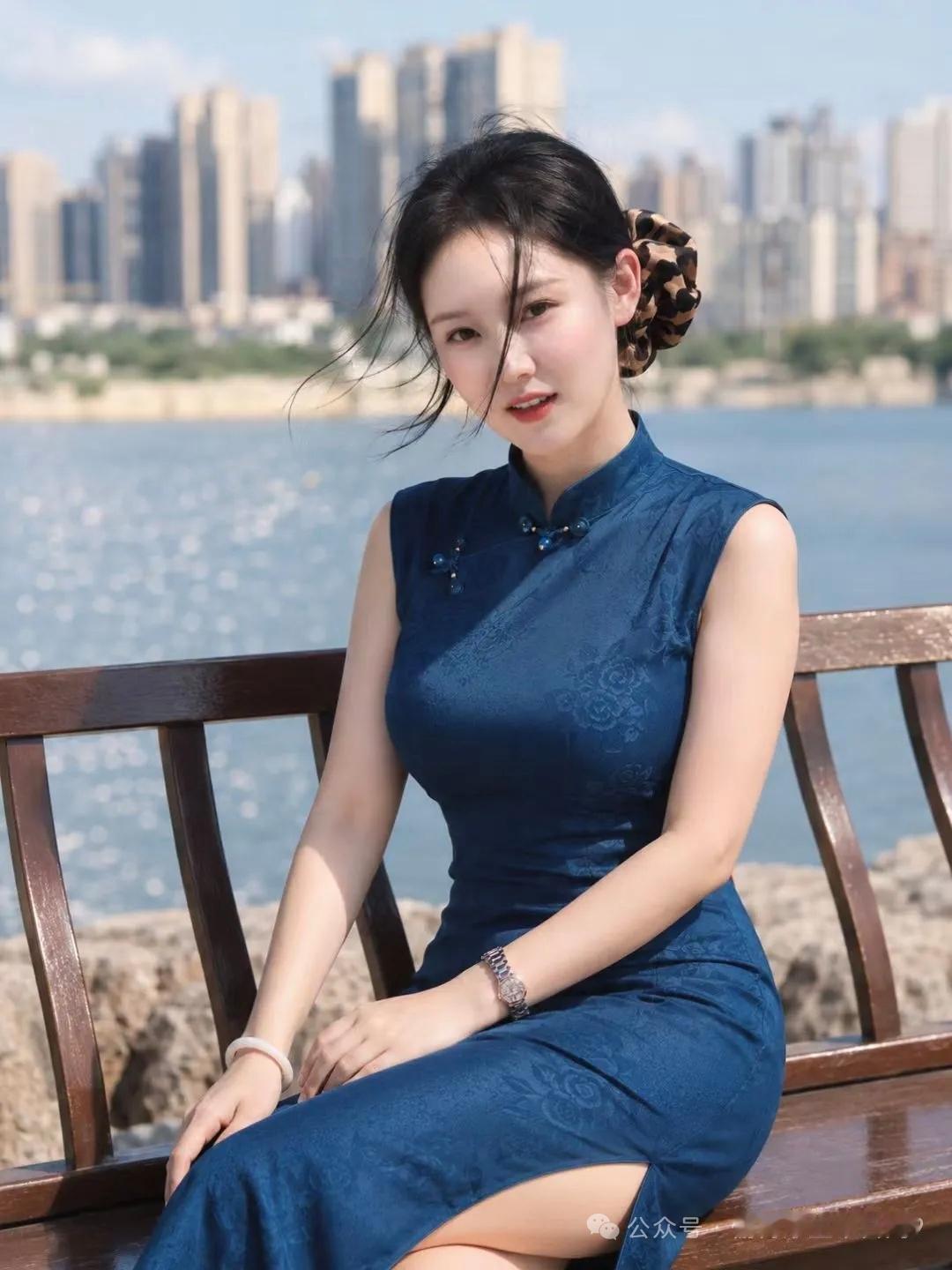 姑娘穿旗袍坐在湖边长椅上。
