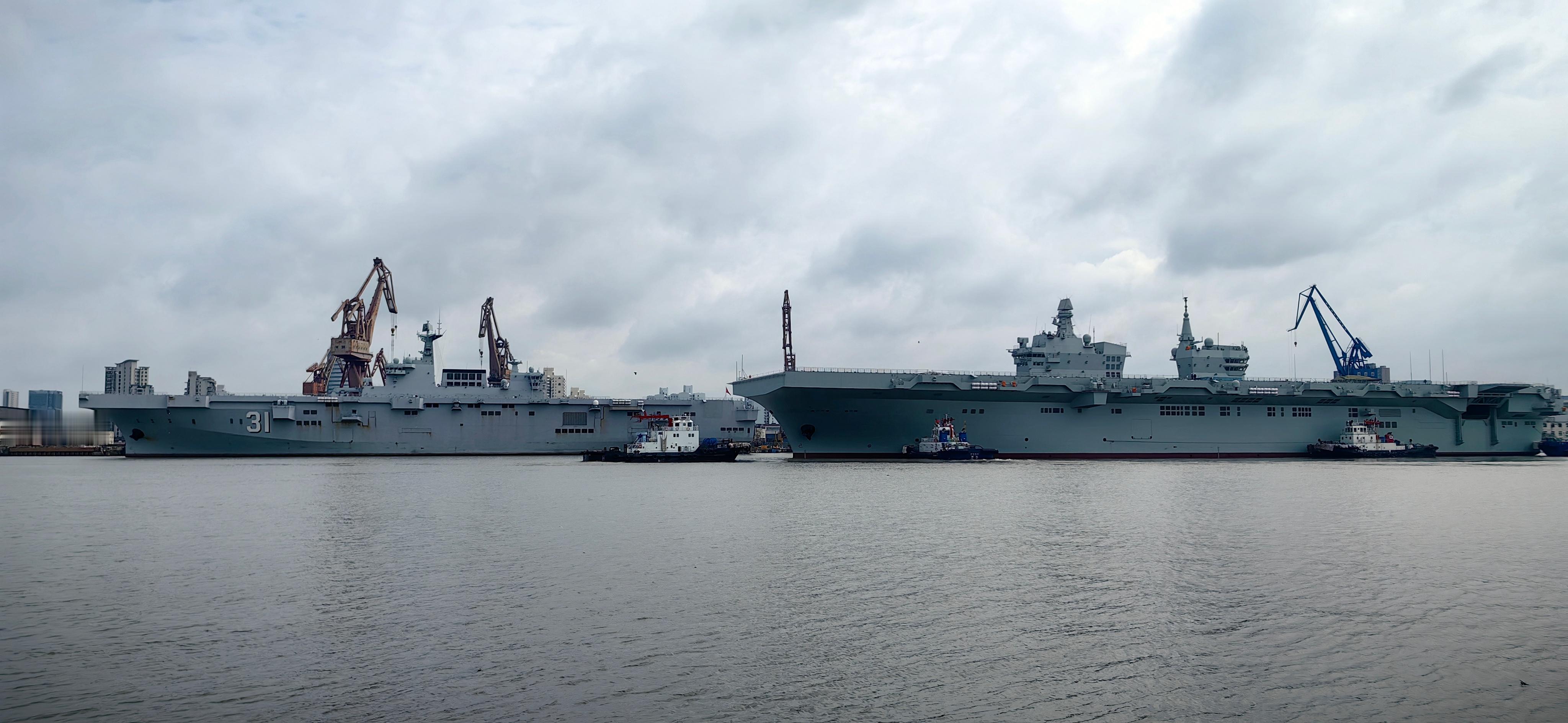 076出坞准备再次试航旁边的31号海南舰准备入坞维护。注意GJ-21无人机已经