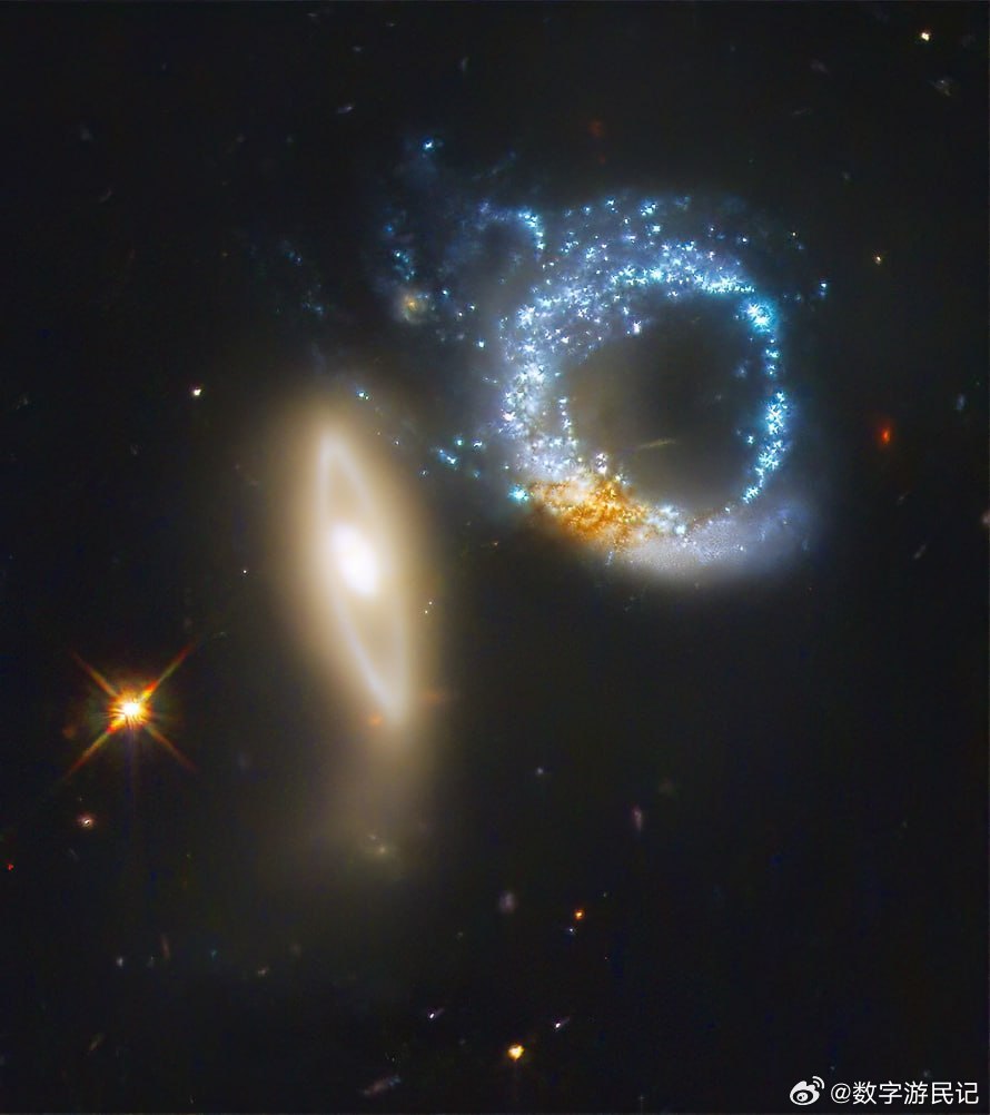 完美十分？相互作用的星系对Arp147形成了一个类似于数字10的形状