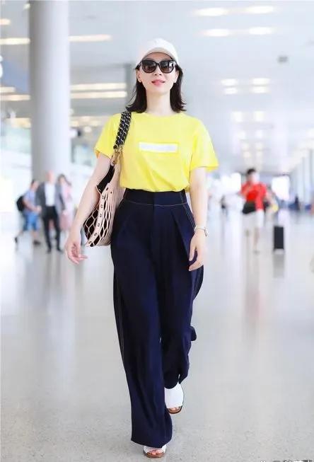 谁能想到陈数已经48岁？这机场私服也太显年轻了！亮黄色T恤提亮肤色，瞬间元