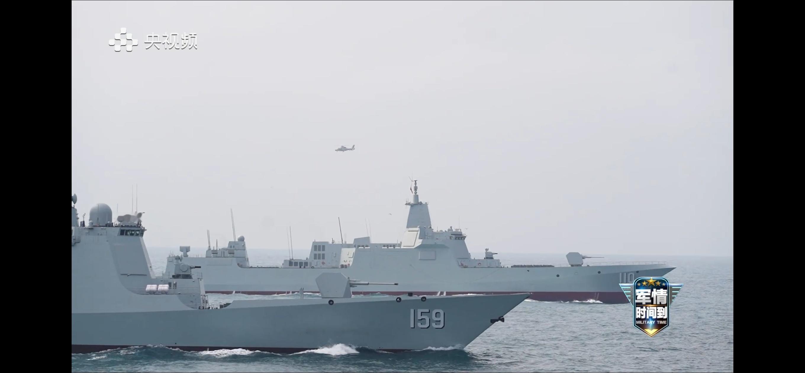 052D型驱逐舰日喀则舰，没算错的话应该是第50艘盾舰。➤空中飞的还是直9烽火问