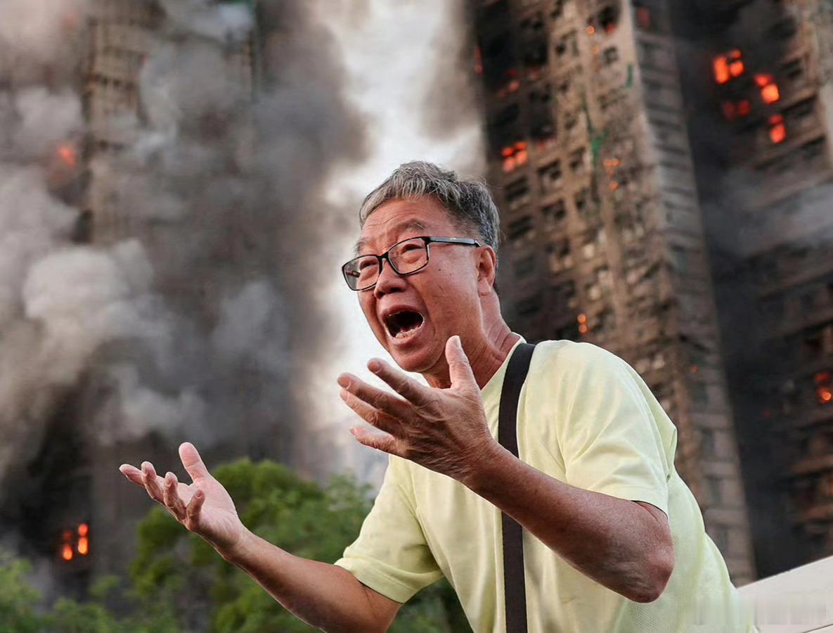 香港火灾，路透社拍下的一位绝望的大叔的照片被众多媒体广泛引用。
