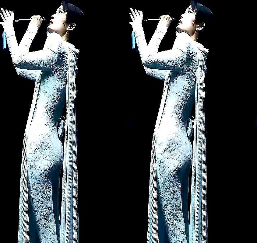 穿了20年西裤的李宇春，竟然穿了一条香芋紫鱼尾裙登台。灯光一打，那条裙子像