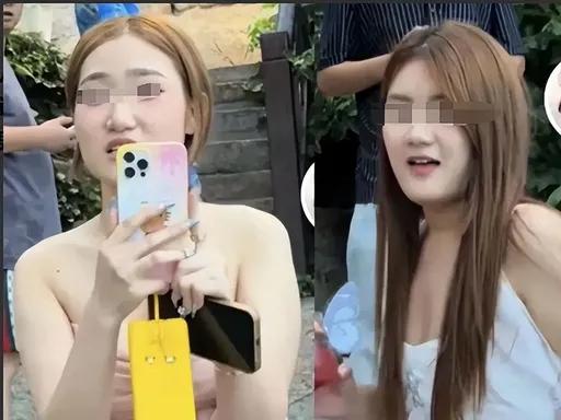 山东青岛海边景区。一孕妇爬台阶，挡住了后面拍照的女大学生。男摄影师催孕妇快点走