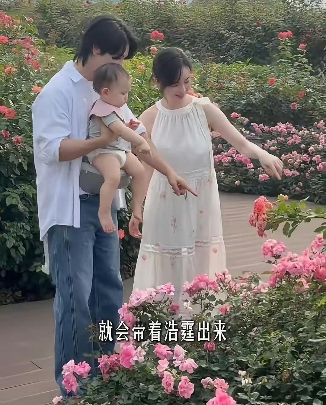 在广州新家的社区花园里，张檬正带着孩子悠闲散步。小Dylan系着一条粉嫩的口水巾