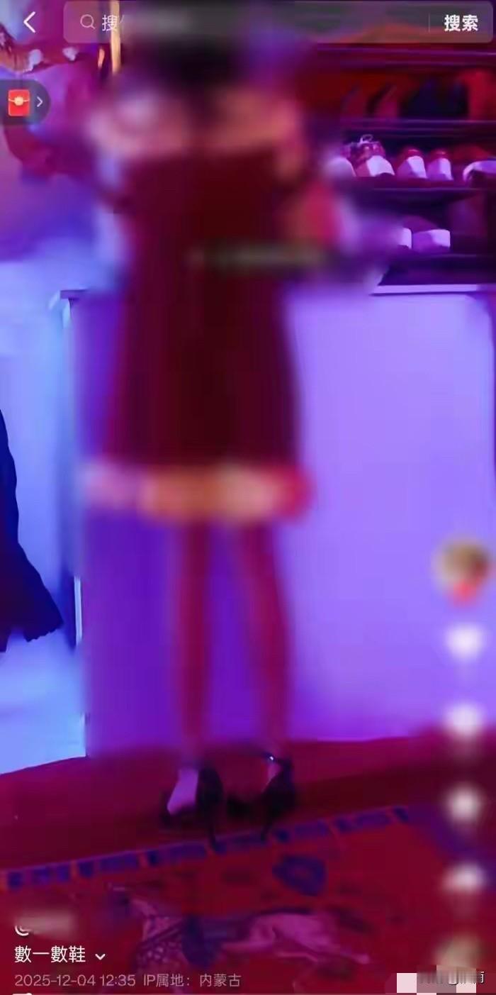 难以理解。视频中一位女士穿着红色紧身露肩连衣裙，脚上穿着一双黑色高跟鞋。文案写道