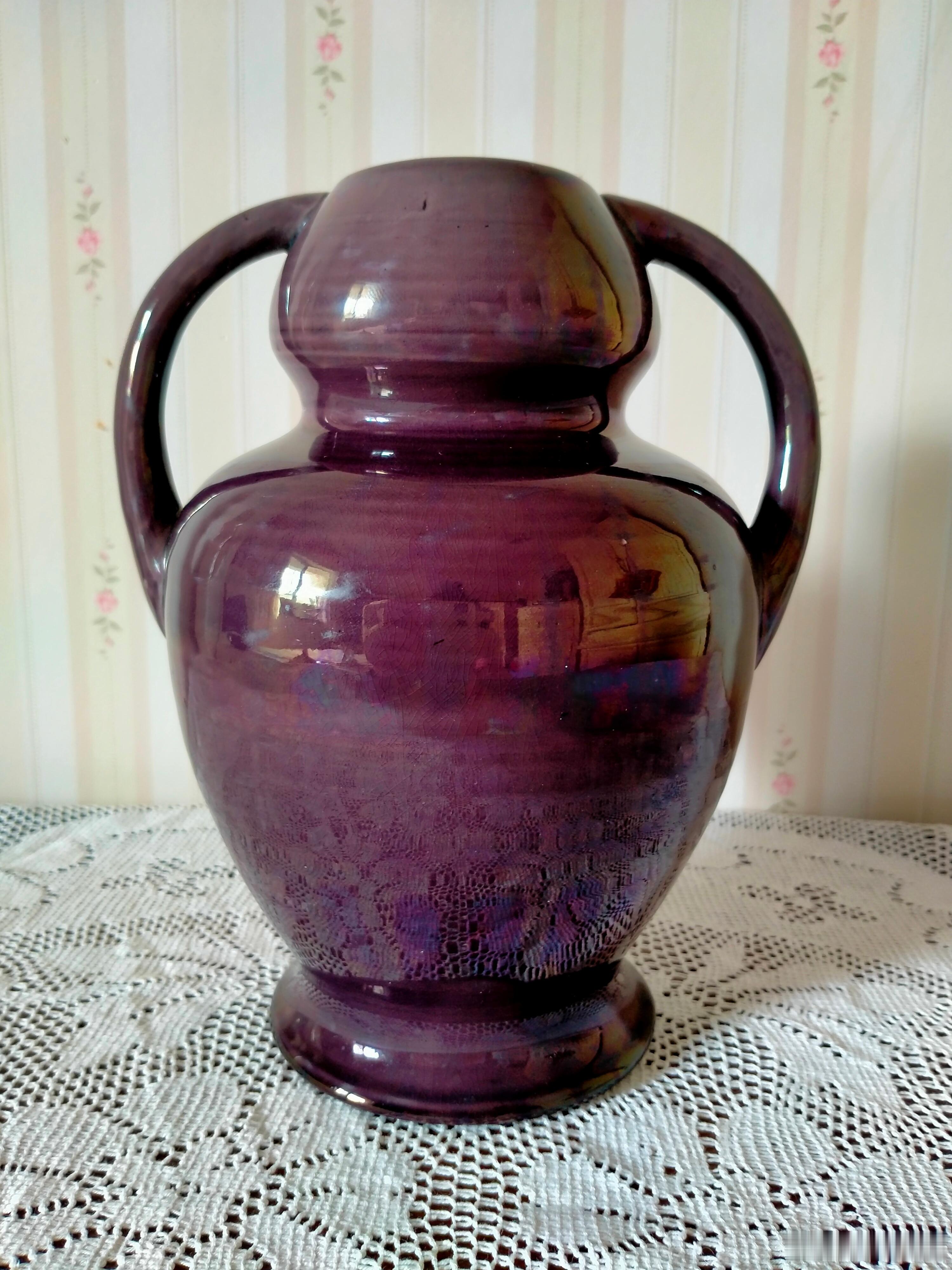 每周鉴赏收藏精品之北宋钧窑紫釉双如意耳葫芦瓶我们认为，北宋中期钧