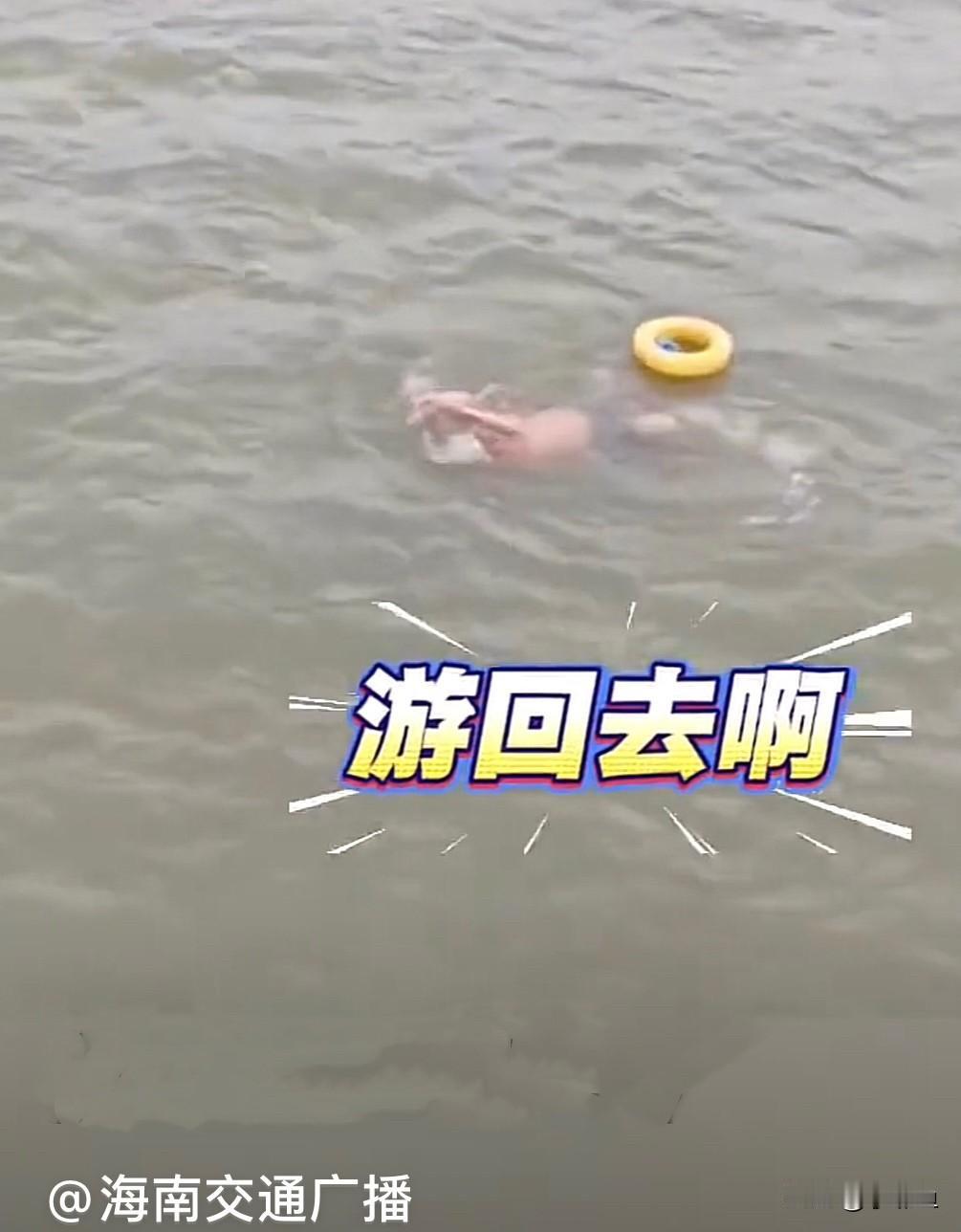 近日，广东惠州东江上有货船正在航行，船主突然发现江中有人正在横渡东江，眼看着越来