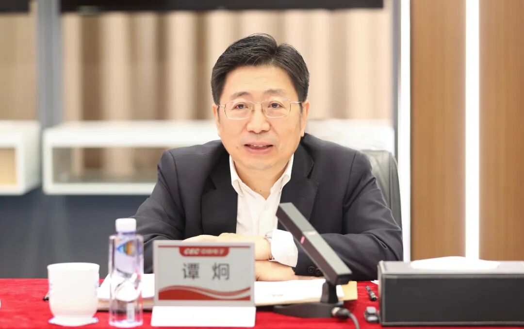 中央决定, 谭炯履新职