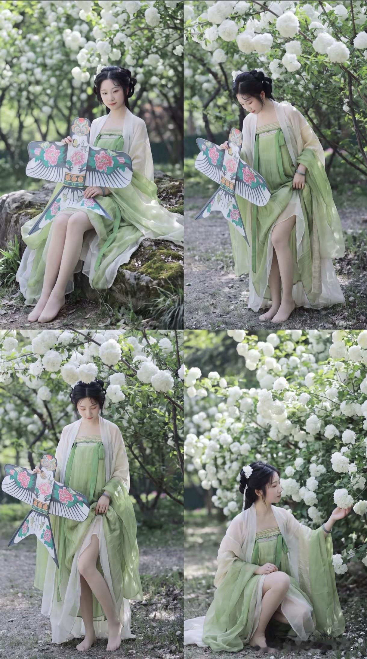 一袭青绿汉服，手执沙燕风筝，像是从古诗里走出的踏青少女。身畔是团团簇簇的白色