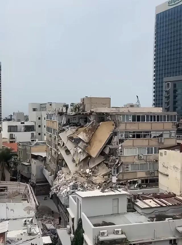 黎巴嫩真主党昨天发射的火箭弹有一枚击中了以色列一栋楼房，造成大面积坍塌。至于到底