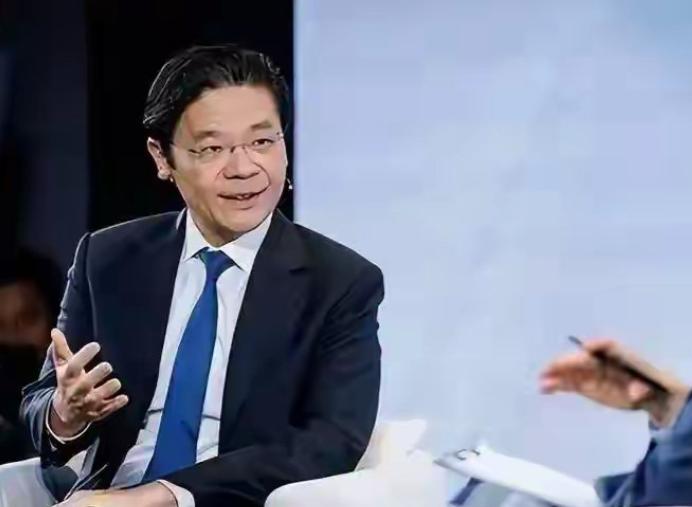 新加坡总理黄循财坐在加拿大电视台的聚光灯下，神情急切，语速紧凑，像急于递交一份“