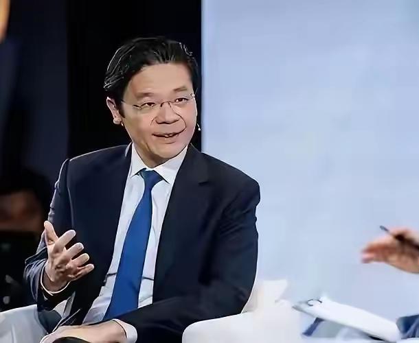 新加坡总理黄循财坐在加拿大电视台的聚光灯下，神情急切，语速紧凑，像急于递交一份“