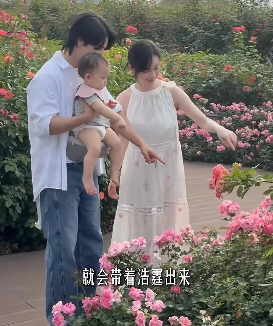 张檬在广州新家小区溜娃，Dylan戴着粉色口水巾，又白又胖好可爱。孩子11个月了