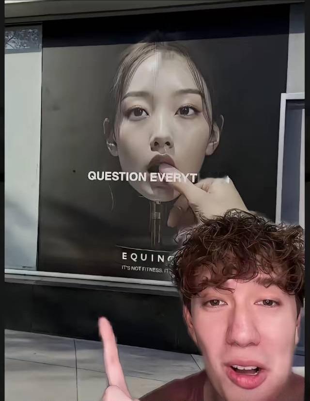 这是一家美国健身房的平面广告，图中女子标准的东亚女性的脸谱，她的表情和动作充满性