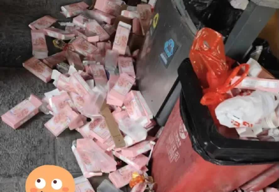 山东，一名女子下楼扔垃圾的时候，远远地看到垃圾桶旁边有一堆粉红色的东西，这些东西