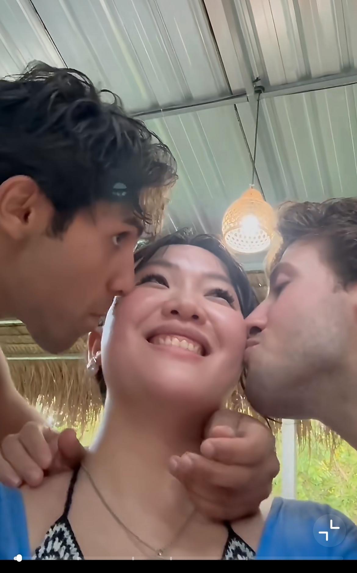 湖北女生巴厘岛旅游被两个意大利小伙亲吻，视频发在抖音引起网友轩然大波，女生对此回