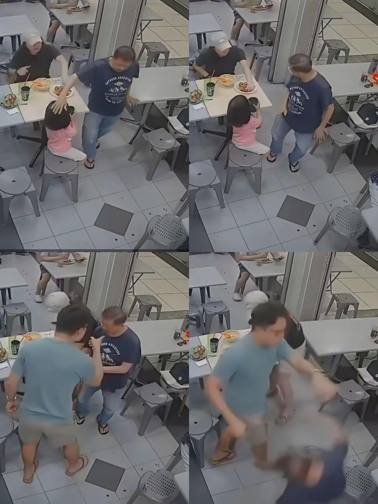 8月15日，新加坡一家餐店内，一对母女正在吃饭。年过七旬的店主老人路过，顺手轻拍