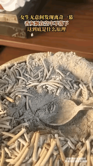 解释不清了！江苏一女子收拾佛龛的香灰时，突然发现，半空中竟然悬浮着，一粒非常小的