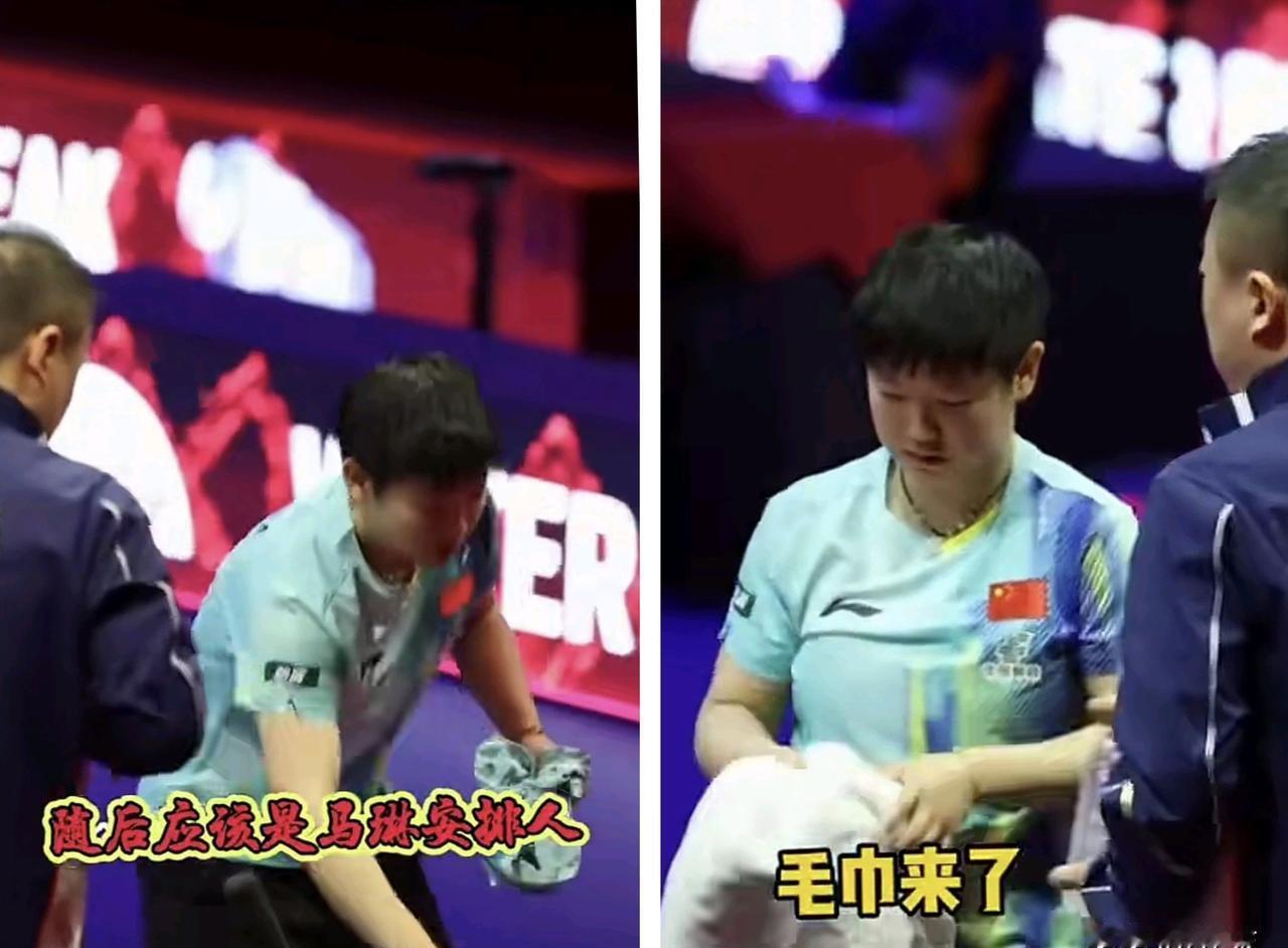 孙颖莎没用国家队毛巾。她直接从包里扯出那件带描边蕾丝的粉色卫衣，擦了把脸上的汗