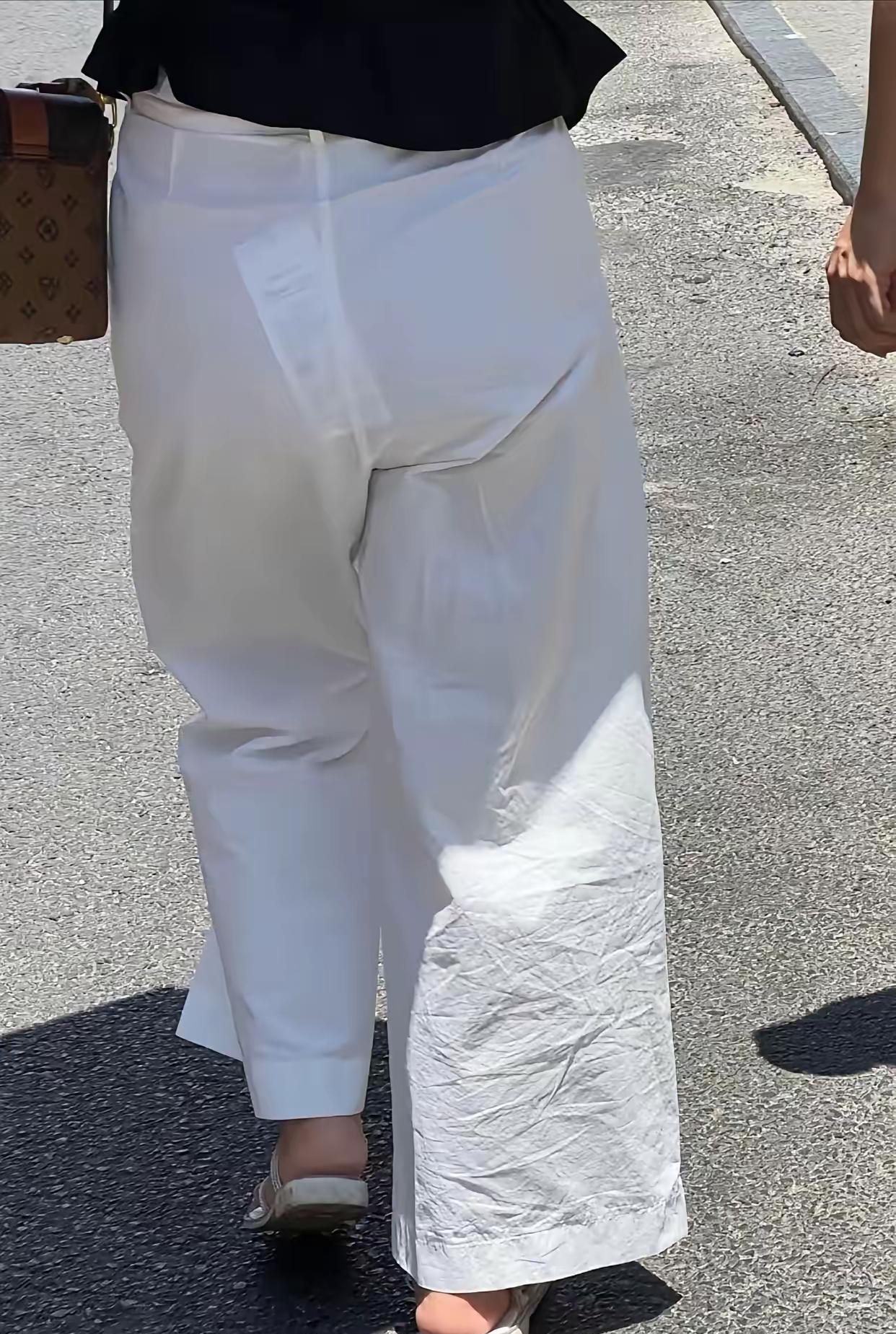真想提个醒你这可是白裤子呀吊牌在那会让人误解实在不雅观真的琢磨不透这