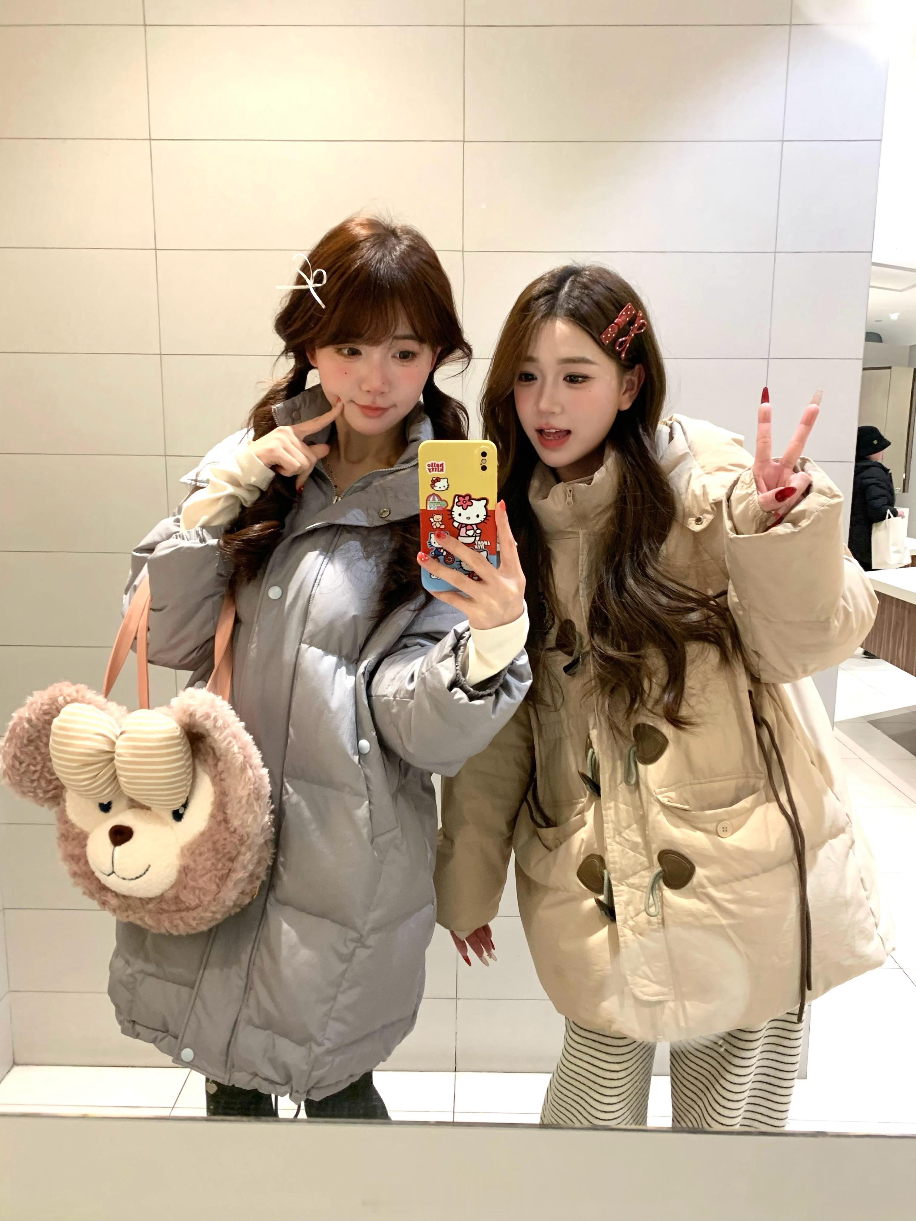 杭州太冷了羽绒服二人组