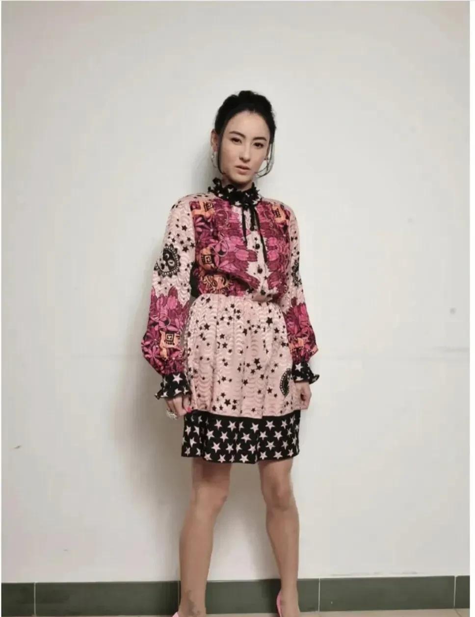 想不到明星也有穿错衣的时候。大美人张柏芝这条裙子，脖子、上身太过繁琐，尤其是下