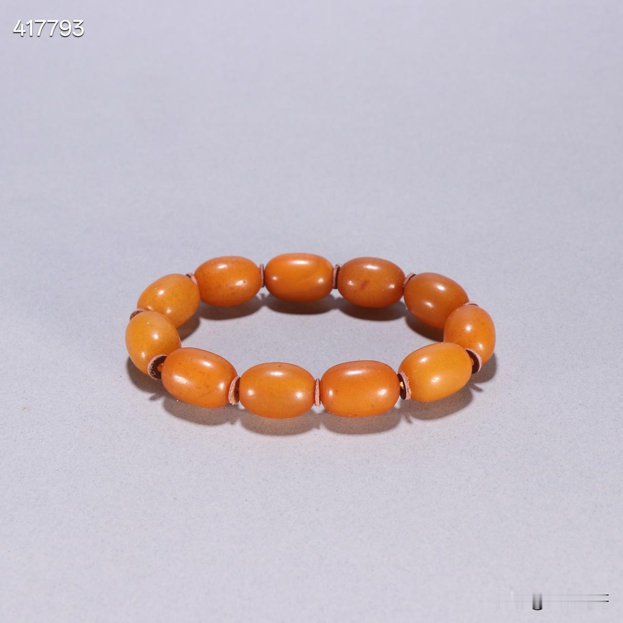 清蜜蜡枣珠手串规格：宽1.7×1.2cm