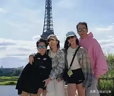 苗圃一家四口远赴法国出游的自在时光。镜头下，一家人站在铁塔前方，衣着休闲随性，每