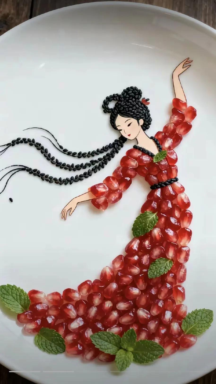 真是个人才，石榴也能贴成一个起舞美女，有空我也买个石榴来试试贴。